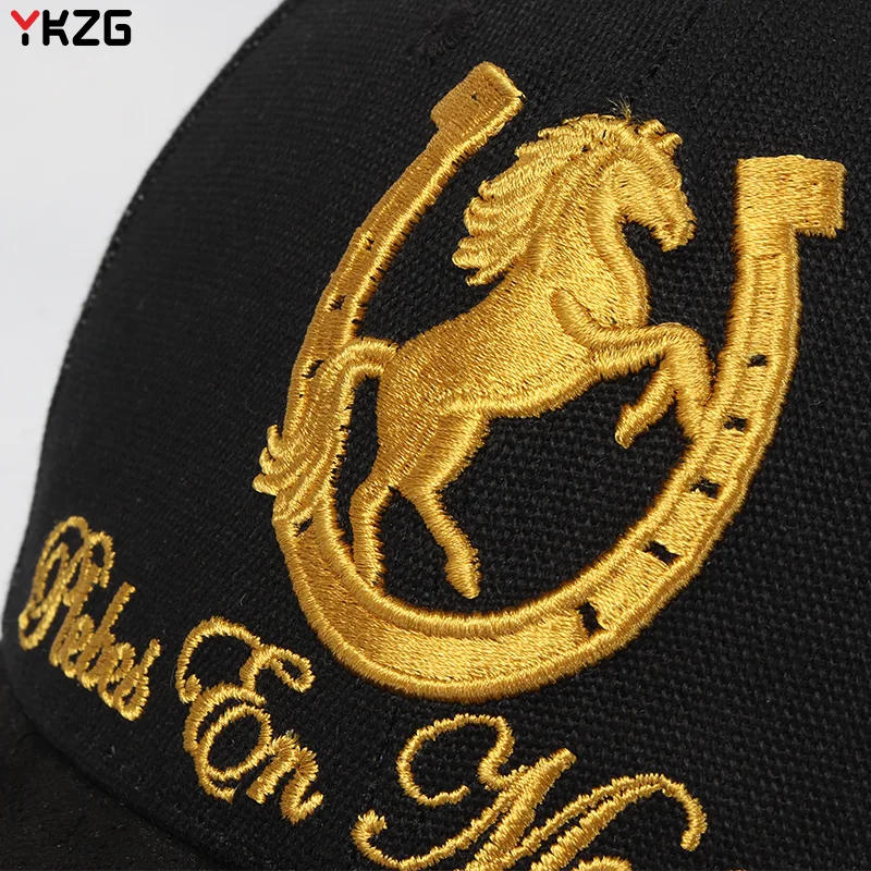 Gold horse-and-horseshoe embroidery on black cap fabric