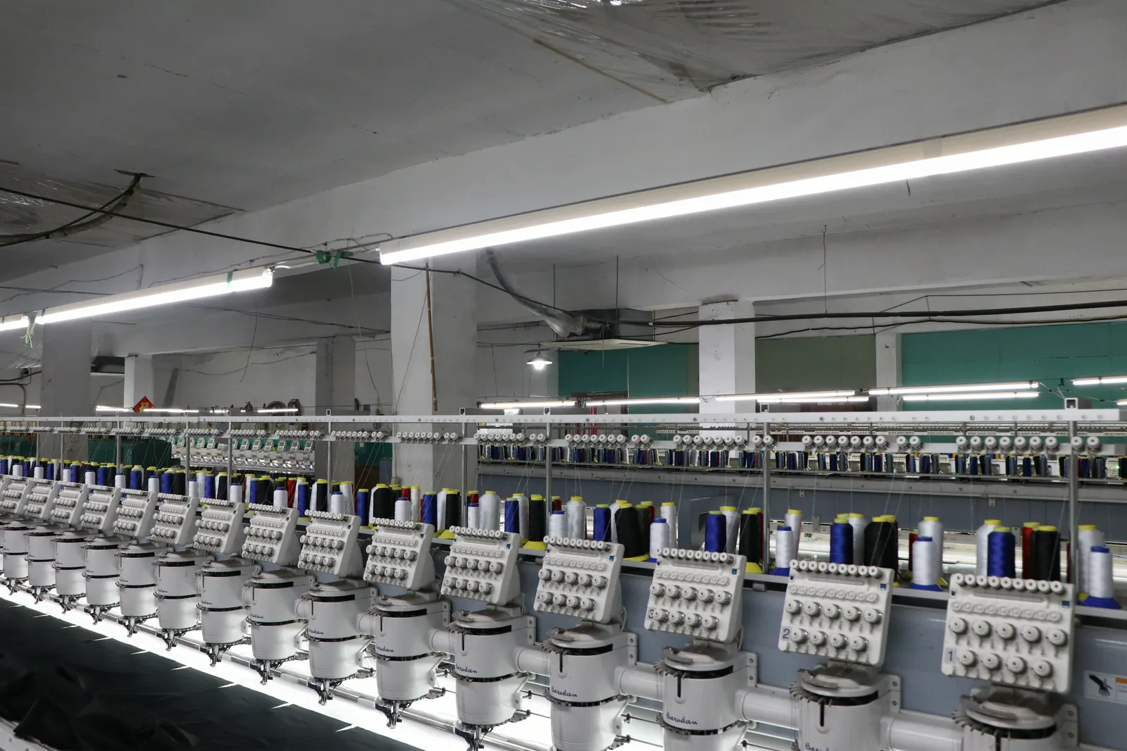 Long row of computerized embroidery heads